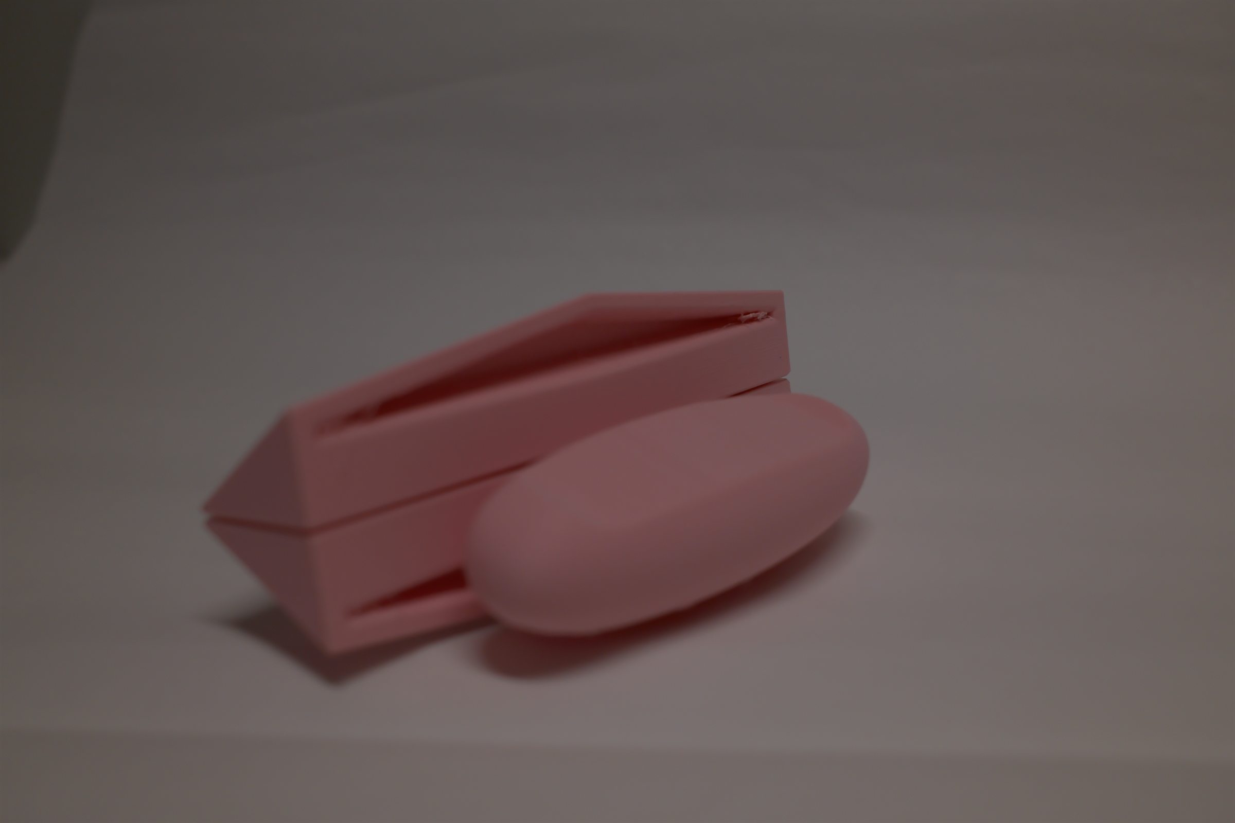 Stacked pink NaRa prototype components.
